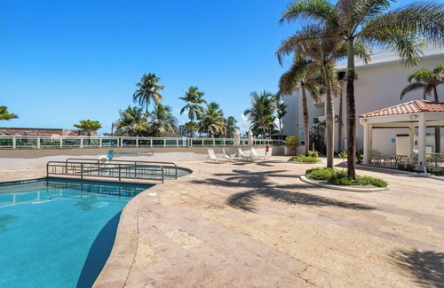 San Juan Antiguo Apartment | Condado Area | Balcony with Beach & Dusk Views | On-site Pool