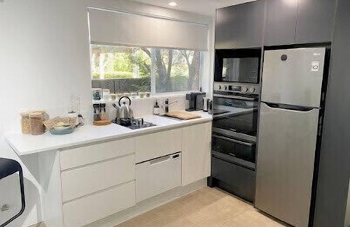 Lake Conjola House | Conjola Inn-Let - with SUP's canoe & bikes for two.