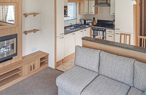 Kilcreggan House | Contemporary 12ft-wide caravan with one double and one twin.
