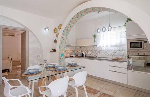 Eden Beach Villa | Cosy apartment in villa for 11 people with pool, A/C, WIFI, TV, patio, pets allowed and parking