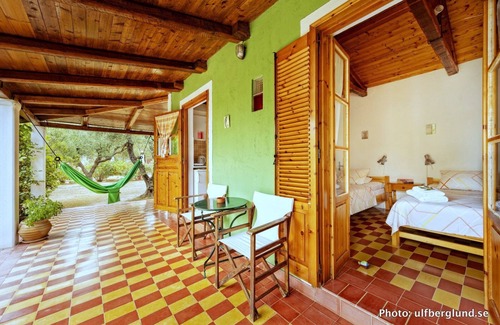 Vasilikos Cottage | Cosy cottage with large veranda and garden with hammock near the beach.