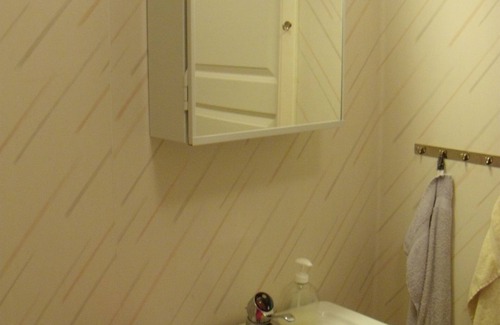 Umea House | Cosy guest room with private guest bathroom