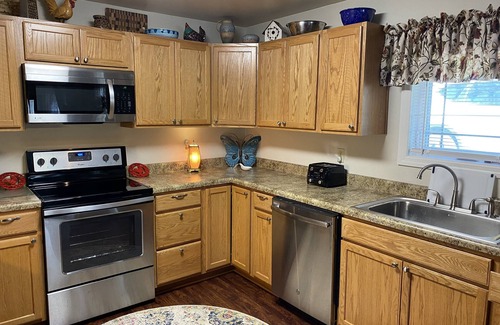 Calvin Cabin | Cottage style cabin, pet friendly, on 4 wooded acres. Sleeps 6-12 people.