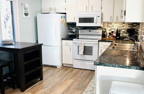 Fridley House | Cozy 2-bedroom retreat in Fridley with Treehouse vibes
