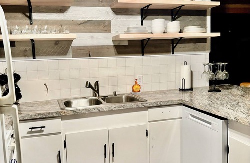 Lansing Township Cabin | Cozy 3-bedroom cabin - sleeps 10- HOT TUB- river viewn