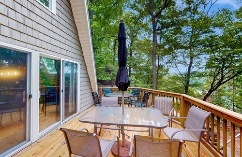 Flat Hollow Marina House | Cozy A-frame home with fire pit, deck, pickleball court, and covered boat slip