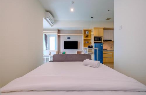 Pekayon Jaya Apartment | Cozy and Great Choice Studio at Grand Kamala Lagoon Apartment By Travelio