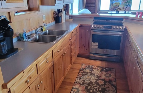 Arbor Vitae Cabin | Cozy boat house on the lake! Private dock and beautiful water views!