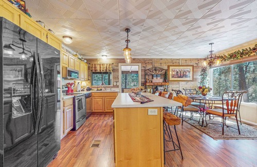 Overgaard Cabin | Cozy cabin with fireplace, farmers porch, central AC & close to trails!
