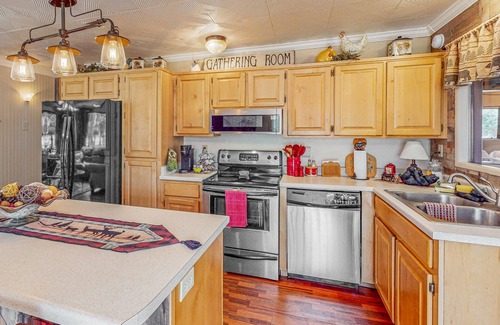 Overgaard Cabin | Cozy cabin with fireplace, farmers porch, central AC & close to trails!