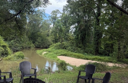 Fluker Cabin | Cozy Camp w/fire pit, grill and waterfront view of river. Pet Friendly!