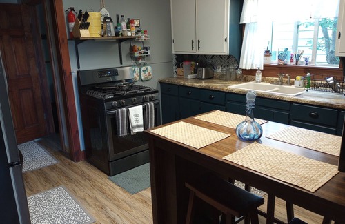 Ishpeming House | Cozy corner lot will provide a comfortable space for a couple or small family.
