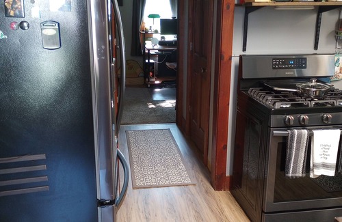 Ishpeming House | Cozy corner lot will provide a comfortable space for a couple or small family.