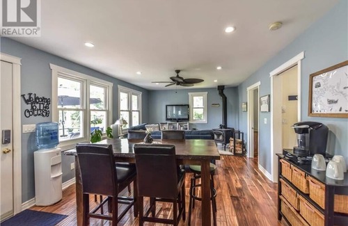 Severn Cottage | Cozy Lakeside Cottage Retreat with Kayaks, Paddle Boat & Sunset Waterfront Views