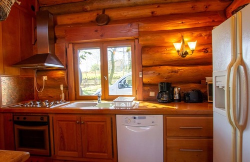 Dussac Cottage | Cozy lakeside log cabin with boat, terrace, and fishing in Périgord Limousin