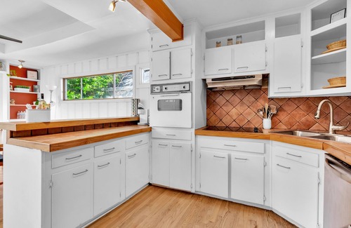 Loring Heights House | Cozy Midtown retreat with skyline views, private yard, deck, firepit, & W/D