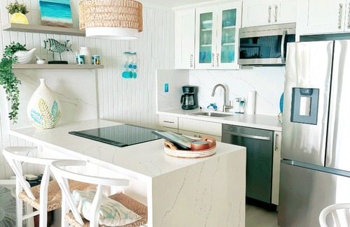 Punaluu Apartment | Cozy oceanfront 1-bedroom condo with WiFi, and access to sandy beach.