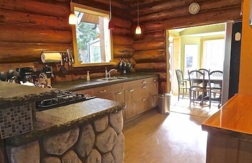 Otter Point Cottage | Cozy Rustic Log Home Living With Wood Fireplace And Hot Tub