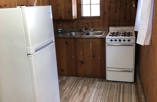 Pentwater Cabin | Cozy "Sailing" Cabin in the woods with Pentwater Lake frontage and access