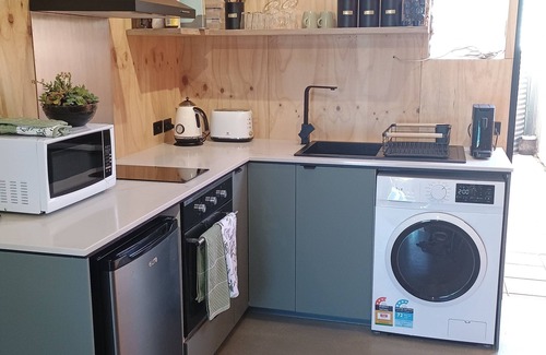 Croydon Park Apartment | Cozy studio with trendy design, fully equipped kitchen, & modern bathroom.