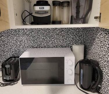 Southeast Calgary Apartment | Cozy vacation! 3min from Cinema Plex, Biggest YMCA, South Health Campus, etc