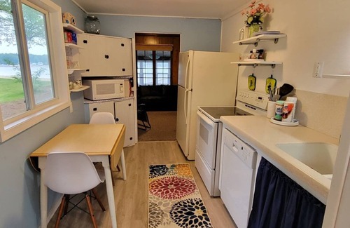 Twin Lake Cottage | Cozy Waterfront Comfy Cottage With Lakeside Fire Pit - Close to Lake Michigan