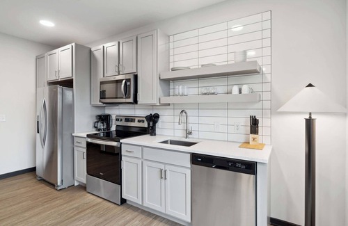 Lockerbie Square Apartment | CozySuites Mass with parking, lounge & roof deck #26