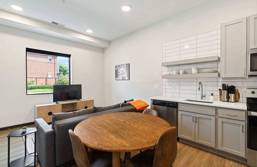 Lockerbie Square Apartment | CozySuites Mass with parking, lounge and roof deck 1