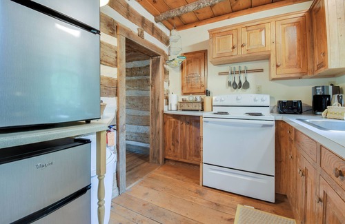 Raphine Cabin | Creekside historic log cabin w/modern amenities at historic Wade's Mill