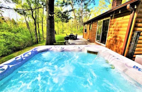 Traverse City House | Creekside Hot Tub-Walk to Beach-Uniquely Northern