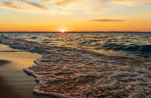 Traverse City House | Creekside Hot Tub-Walk to Beach-Uniquely Northern