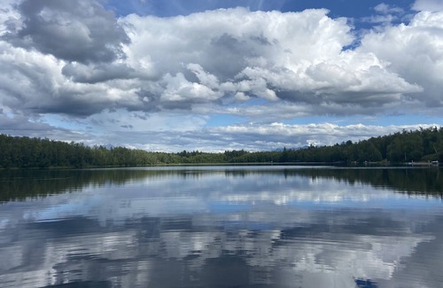 Tanaina Cabin | Custom built modern cabin with a loft on a lake with mountain views.