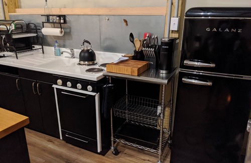 Wooster Cabin | Custom design Safari Tent overlooking a serene running creek & natural waterfall