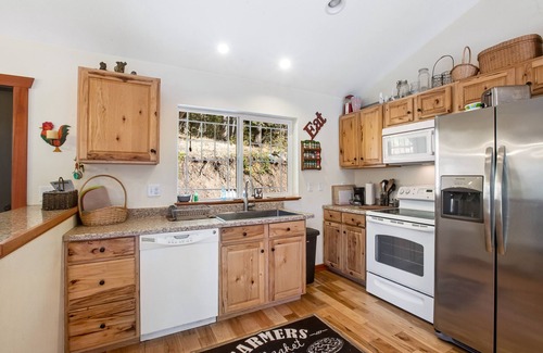 Ronald House | Custom home with balcony, radiant floor heating & washer/dryer
