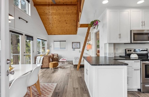 Camano Island House | Darling pink beach house with epic views in a cozy community.