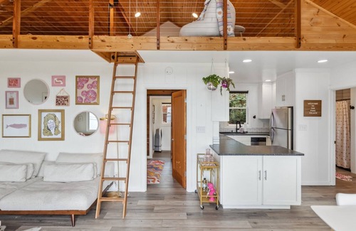 Camano Island House | Darling pink beach house with epic views in a cozy community.