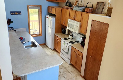 Mancelona Condo | Deck with views! 2 bed 2 bath sleeps 6-8, pool,close to Torch Lake, Boat parking