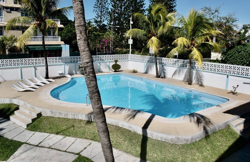 Pereybere Apartment | Delightful apartment with pool, 3 minutes walk to beaches, restaurants & shops.