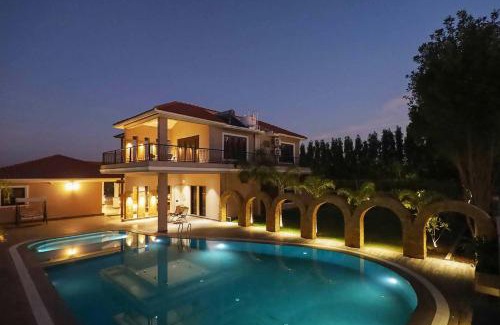 Anjar Villa | Desert Palms by StayVista in Kutch, nestled in orchards, features a swimming pool and a scenic balcony for a serene getaway