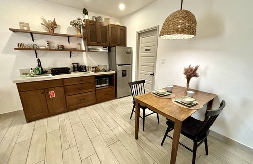 Belize City Apartment | Designer Chic Suite with Patio - Fully Stocked for Your Stay