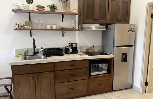 Belize City Apartment | Designer Chic Suite with Patio - Fully Stocked for Your Stay