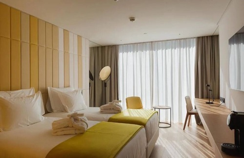 Sao Jorge de Arroios Hotel | Dive into Lisbon Nights: Rooftop Pool & Magical Light Show Views