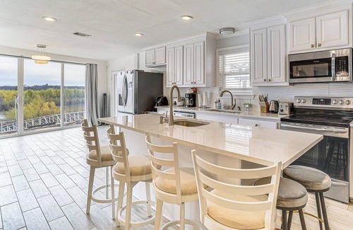 Runaway Bay House | Dock & Fire Pit: Riverfront Runaway Bay Retreat