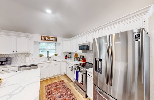The Colony House | Dog-friendly brick home near golf with pool, central AC, & washer/dryer