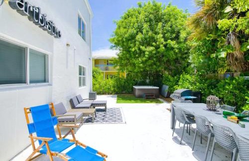 Palm Beach Shores Apartment | Dog friendly condo with beach access, hot tub, firepit