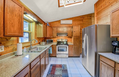 McHenry Cabin | Dog-friendly home with private pond, wraparound porch & fireplaces
