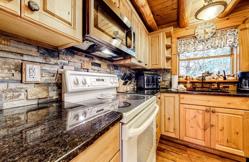 Cresco Cabin | Dog-friendly log cabin with great outdoor bar, firepit, fireplace & porches