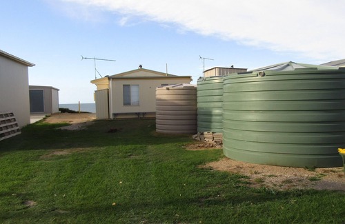 Carribie House | Dot n Pats ~ Absolute Beachfront! Free Wifi