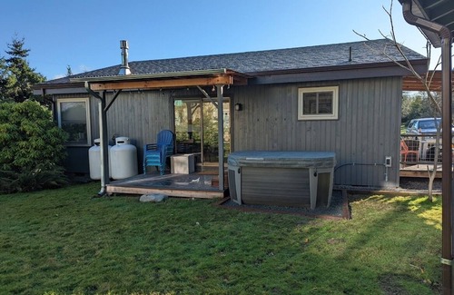 Freeland House | Downtown retreat with hot tub, & beach steps away