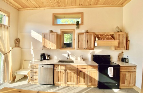 Britt Cottage | Duplex style cottage, 2 kitchens! Nestled in quaint area on River. Dock access!
